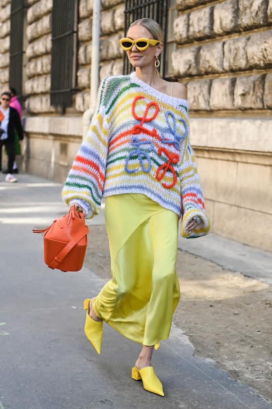 PARIS, FRANCE - SEPTEMBER 30: Leonie Hanne is seen wearing a Loewe sweater, Loewe yellow skirt, Loewe orange bag and heels outside the Loewe show during Paris Fashion Week S/S 2023 on September 30, 2022 in Paris, France. (Photo by Daniel Zuchnik/Getty Images)