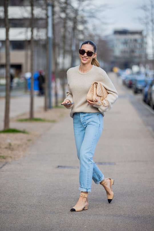 DUSSELDORF, GERMANY - FEBRUARY 06: Ann-Kathrin Götze is seen wearing beige Ferragamo jumper, denim jeans Saint Laurent, Chanel bag and shoes in beige, sunglasses Dior on February 06, 2021 in Dusseldorf, Germany. (Photo by Christian Vierig/Getty Images)