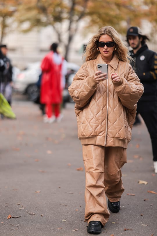 PARIS, FRANCE - OCTOBER 05: Emili Sindlev wearing a brown jacket, pants and black shoes outside Miu Miu Show on October 05, 2021 in Paris, France. (Photo by Jeremy Moeller/Getty Images)