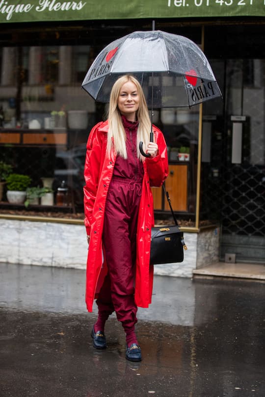 PARIS, FRANCE - MARCH 02: Thora Valdimars is seen wearing red varnished coat, overall, black bag outside Sacai during Paris Fashion Week - Womenswear Fall/Winter 2020/2021 : Day Eight on March 02, 2020 in Paris, France. (Photo by Christian Vierig/Getty Images)