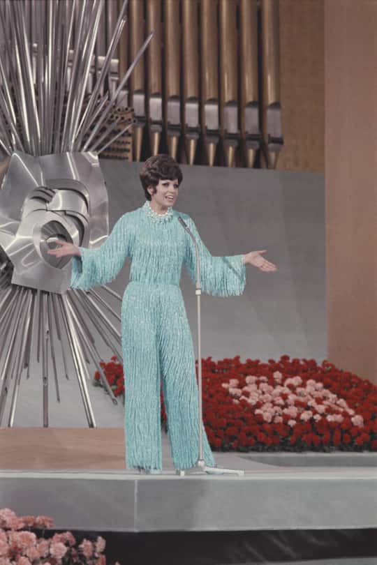 Spanish singer Salome, Spain's entry for the 1969 Eurovision Song Contest, performs her song 'Vivo cantando' to finish in joint first place inside the Teatro Real in Madrid, Spain on 29th March 1969. (Photo by Rolls Press/Popperfoto via Getty Images/Getty Images)