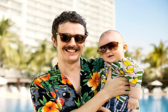 Father and his son with hawaian shirts