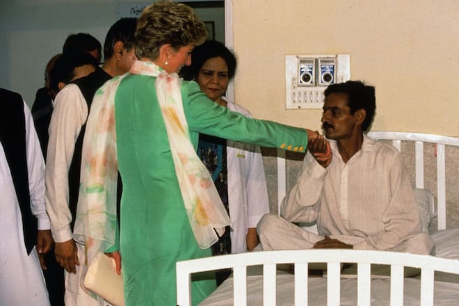 LAHORE, PAKISTAN - SEPTEMBER 25: Diana, Princess of Wales is kissed on the hand by a patient as she visits a detox centre on September 25, 1991 in Lahore, Pakistan. (Photo by Anwar Hussein/Getty Images)