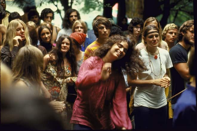 Psylvia, dressed in a pink Indian shirt dancing in the midst of the crowd, during the Woodstock Music & Art Festival. (Photo by Bill Eppridge/The LIFE Picture Collection via Getty Images)