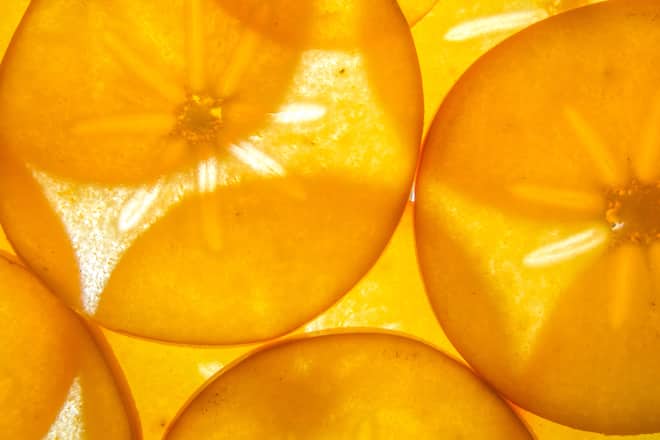 back lit ripe kaki persimon fruit