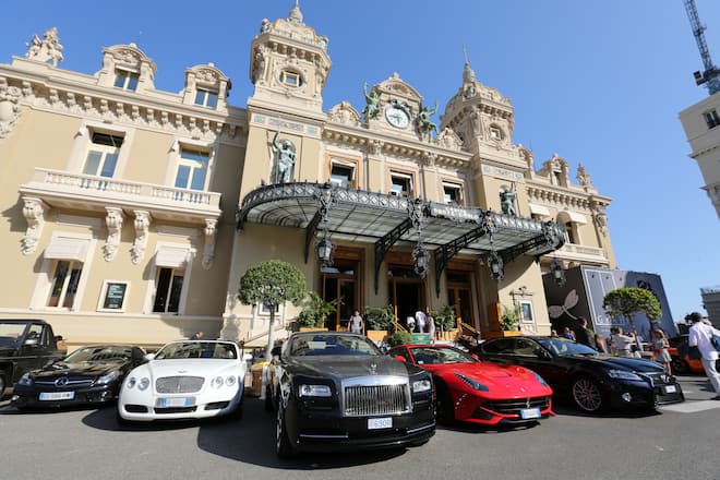 Luxury automobiles, including a Bentley, second left, a Rolls-Royce, center, and a Ferrari sports car, second right, stand outside the Casino de Monte-Carlo in Monaco, on Monday, May 18, 2015. The ultra-luxury housing market is scaling new heights as a record number of properties around the world command prices topping $100 million. Photographer: Andrey Rudakov/Bloomberg via Getty Images