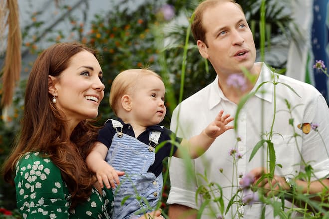 LONDON, ENGLAND - JULY 02: (EDITORIAL USE ONLY) Catherine, Duchess of Cambridge holds Prince George as he and Prince William, Duke of Cambridge's look on while visiting the Sensational Butterflies exhibition at the Natural History Museum on July 2, 2014 in London, England. The family released the photo ahead of the first birthday of Prince George on July 22. (Photo by John Stillwell - WPA Pool/Getty Images)