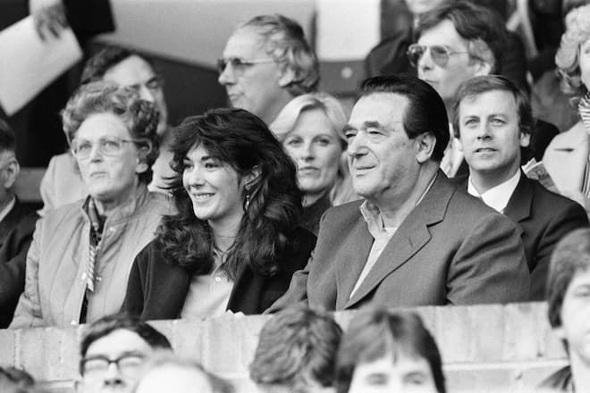 Robert Maxwell and his daughter Ghislaine watch the Oxford v Brighton football match, 13th October 1984. (Photo by Staff/Mirrorpix/Getty Images)