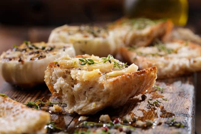 Roasted Garlic Spread on Toasted Baguette with Salt, Pepper, Thyme and Olive Oil