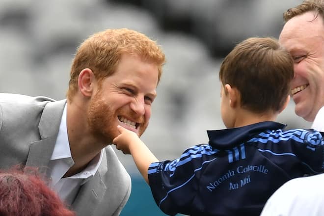 The Duke of Sussex has his beard stroked by a small child in Croke Park on the second day of his visit to Dublin, Ireland. (Photo by Dominic Lipinski/PA Images via Getty Images)