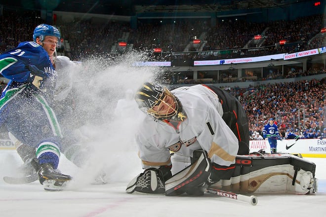 VANCOUVER, CANADA - APRIL 25: Mason Raymond #21 of the Vancouver Canucks drew a penalty for spraying Jonas Hiller #1 of the Anaheim Ducks during their NHL game at Rogers Arena April 25, 2013 in Vancouver, British Columbia, Canada. Anaheim won 3-1. (Photo by Jeff Vinnick/NHLI via Getty Images)