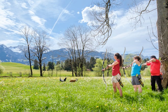 three people with archers